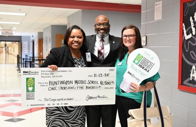 Winners holding reward check